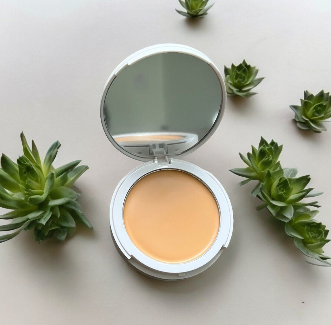 Compact 2-in-1 FlawlessBlend foundation and concealer with mirror surrounded by green succulents GlowUp CC Cream