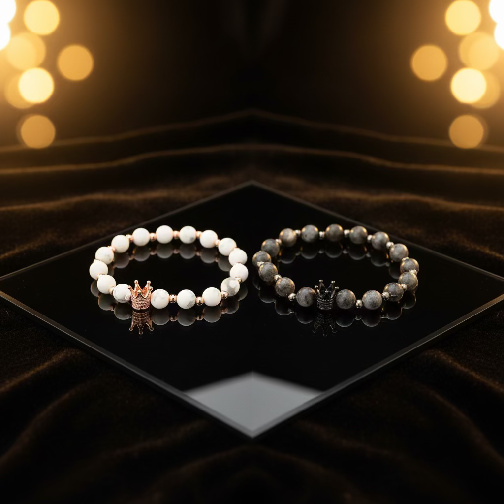 Equilibrium Bracelet Set with white marble and midnight black stone beads featuring gold accents and crown charm