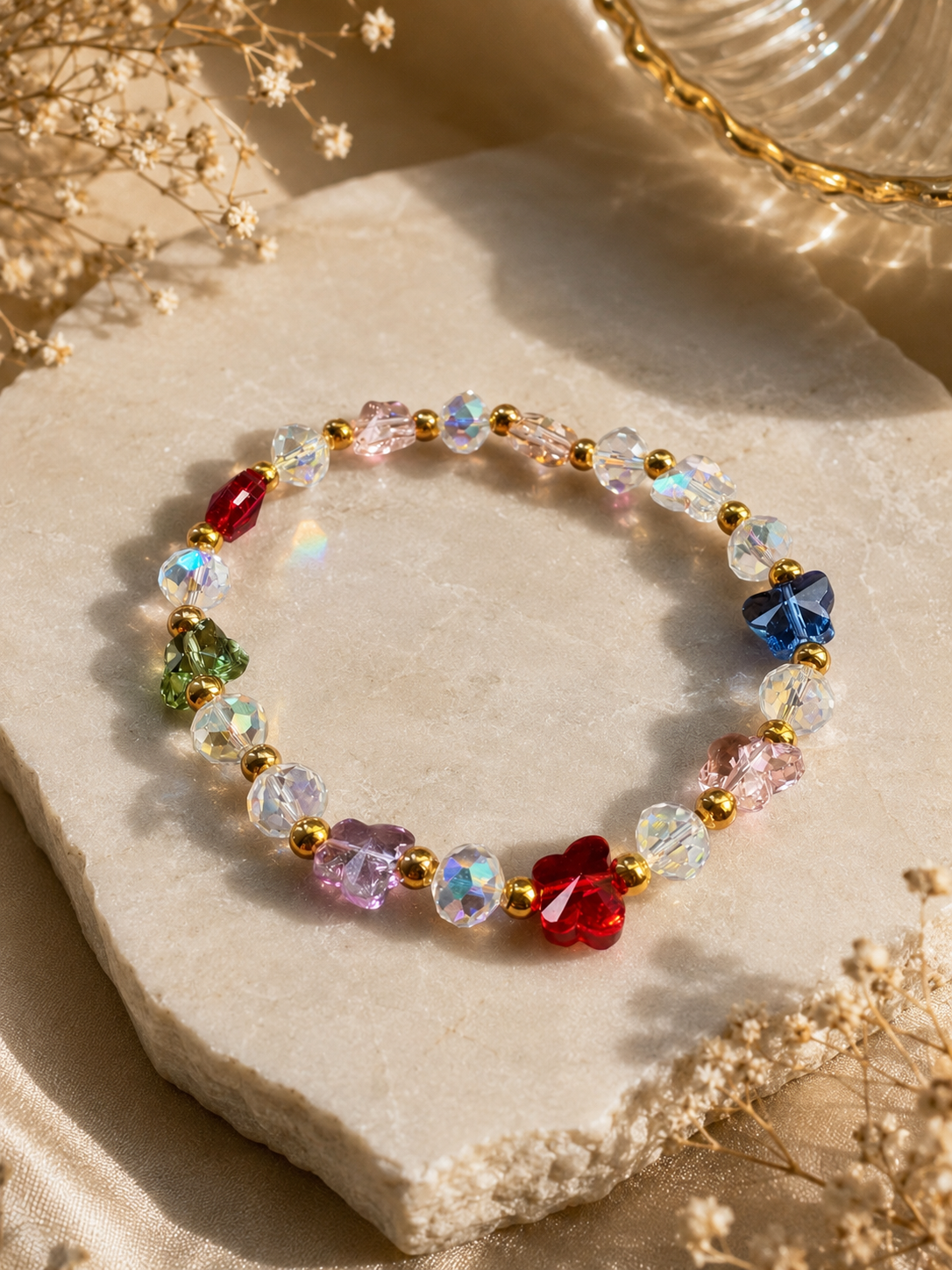 Aurora Bloom Crystal Bracelet with shimmering faceted beads, floral accents, and gold spacers