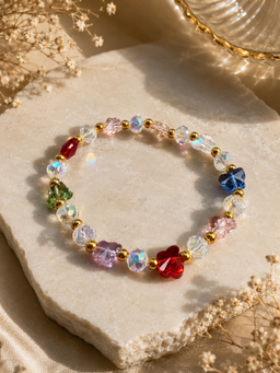 Aurora Bloom Crystal Bracelet with shimmering faceted beads, floral accents, and gold spacers