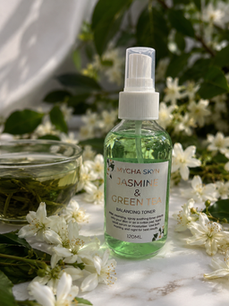 Jasmine and green tea botanical facial mist bottle with leaves and flowers
