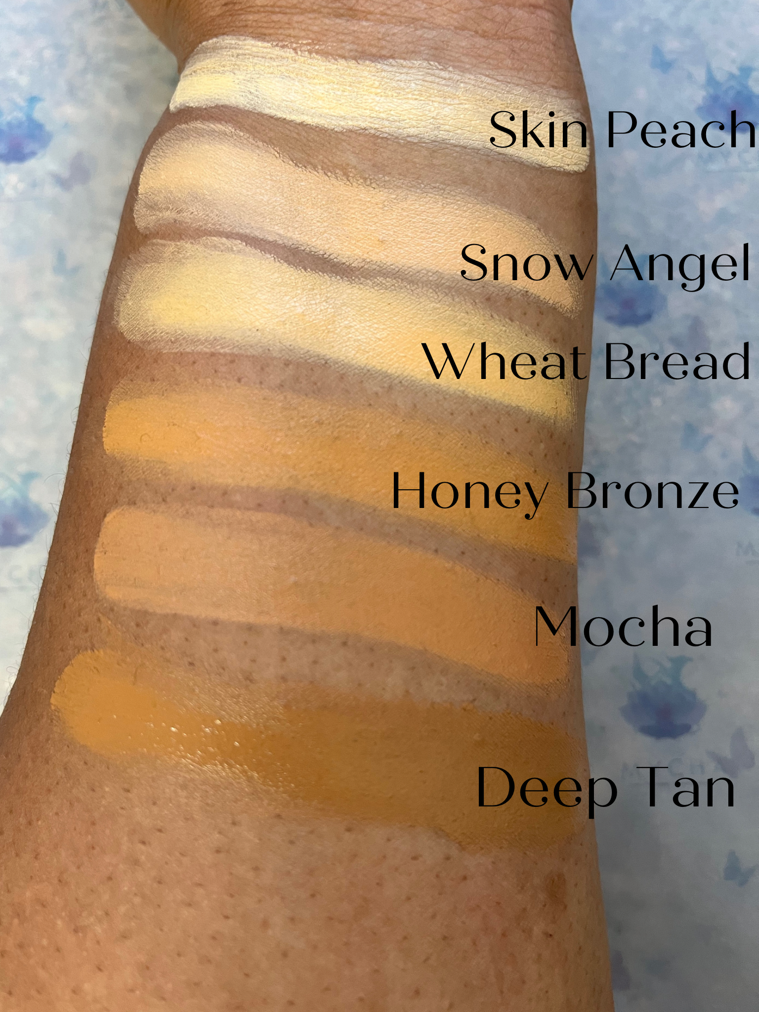 Swatches of Flawless Blend 2 in 1 foundation and concealer in various shades on skin arm showcasing GlowUp CC Cream colors.