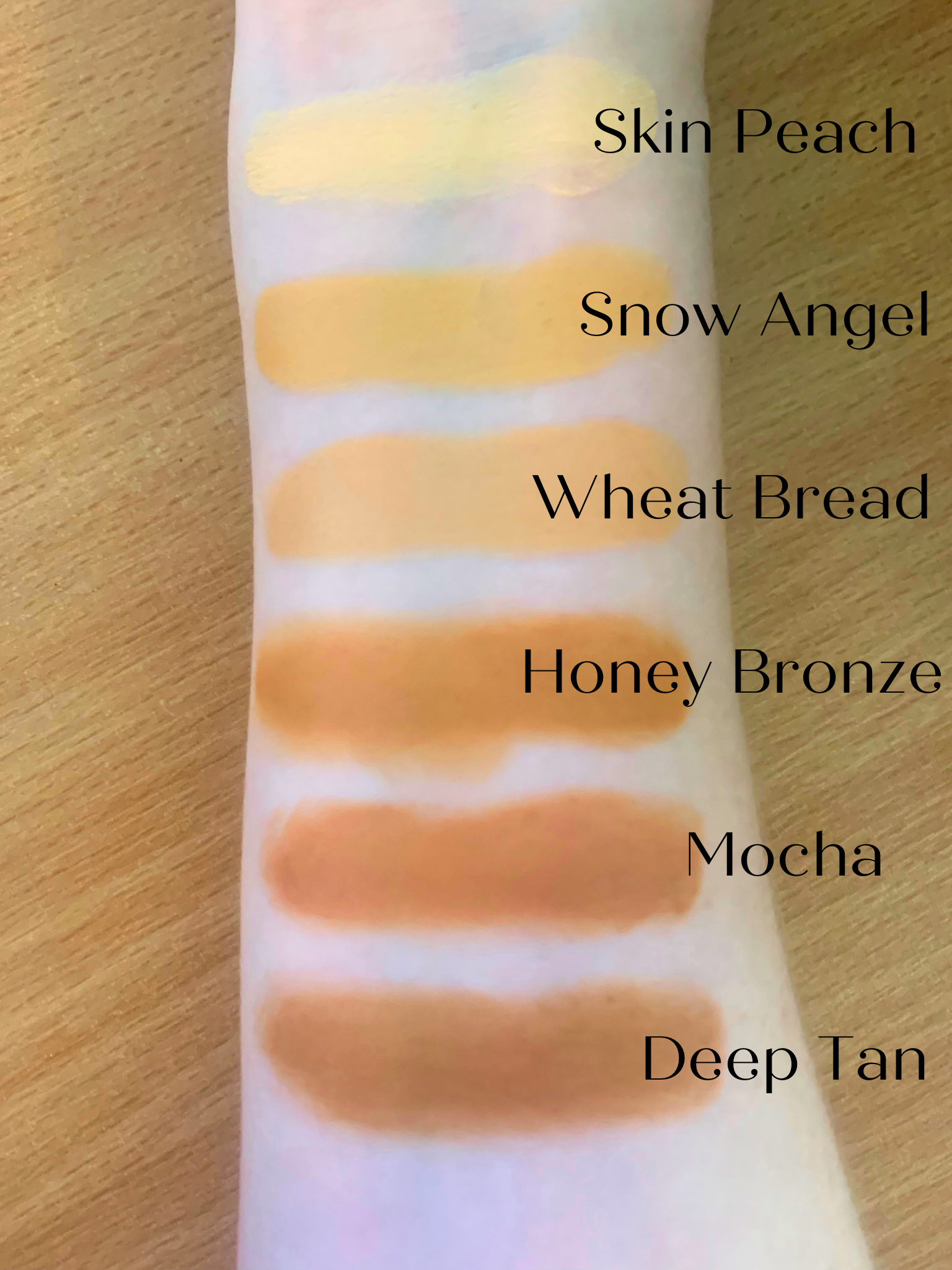 Arm swatches of Flawless Blend 2 in 1 foundation and concealer in six shades: Skin Peach, Snow Angel, Wheat Bread, Honey Bronze, Mocha, and Deep Tan.